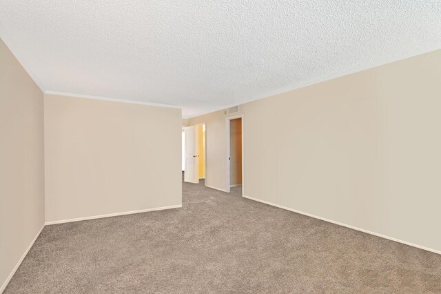 2800 S Ocean Blvd Unit 2-A, Boca Raton, FL 33432 - unfurnished room featuring carpet floors, ornamental molding, a textured ceiling, and baseboards