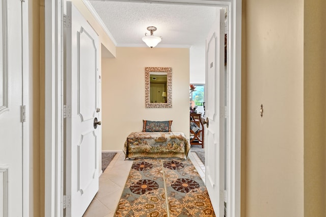 2800 S Ocean Blvd Unit 2-A, Boca Raton, FL 33432 - hallway featuring crown molding, a textured ceiling, and light tile patterned floors