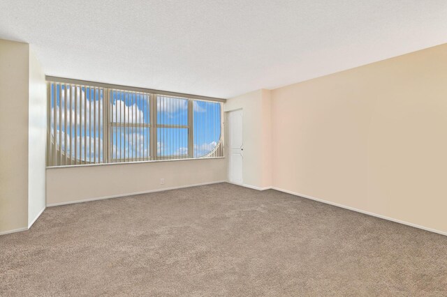 2800 S Ocean Blvd Unit 2-A, Boca Raton, FL 33432 - carpeted spare room with baseboards