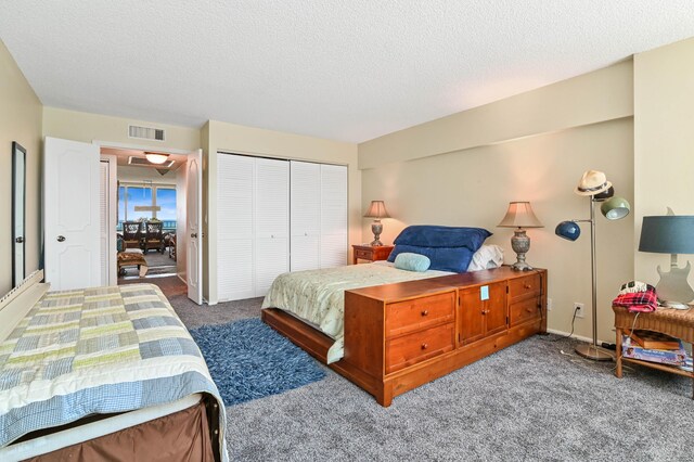 2800 S Ocean Blvd Unit 2-A, Boca Raton, FL 33432 - bedroom with carpet, a closet, a textured ceiling, and visible vents