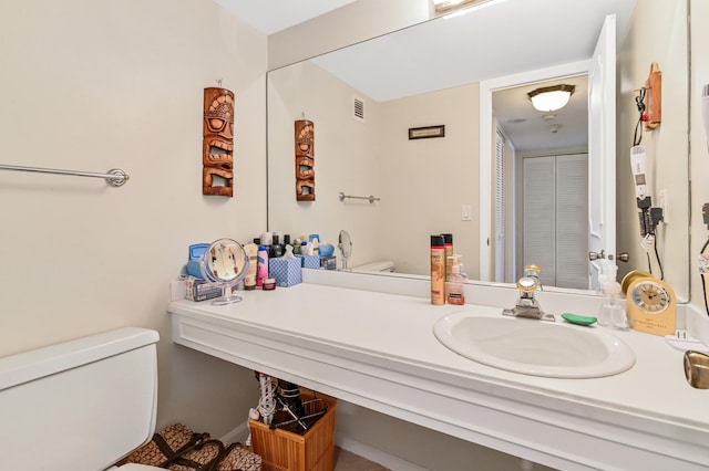 2800 S Ocean Blvd Unit 2-A, Boca Raton, FL 33432 - bathroom featuring toilet, visible vents, and vanity