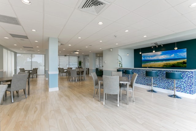 2800 S Ocean Blvd Unit 2-A, Boca Raton, FL 33432 - dining space with visible vents, baseboards, wood finished floors, and a drop ceiling