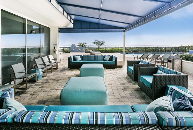 2800 S Ocean Blvd Unit 2-A, Boca Raton, FL 33432 - view of patio with a water view and an outdoor living space
