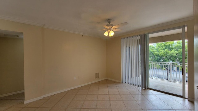 empty room featuring crown molding, light tile patterned floors, and ceiling fan