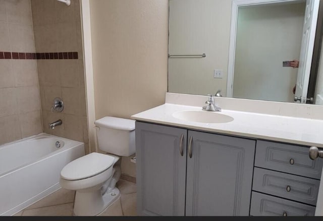 full bathroom with tile patterned flooring, vanity, toilet, and tiled shower / bath combo