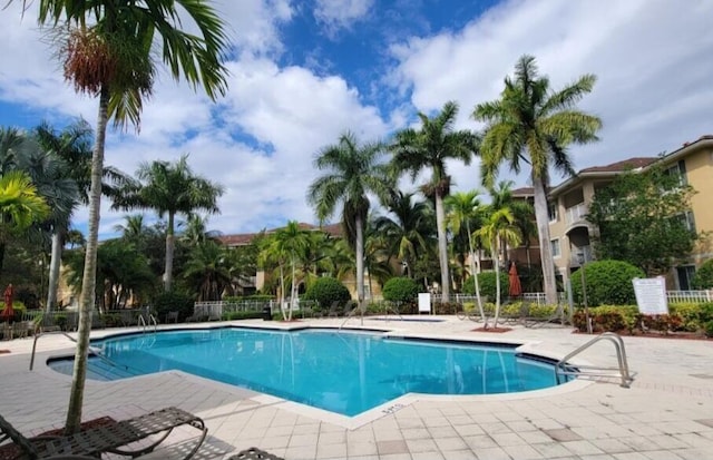 view of swimming pool with a patio area