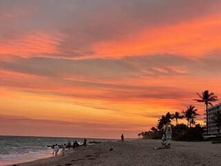 nature at dusk with a beach view and a water view