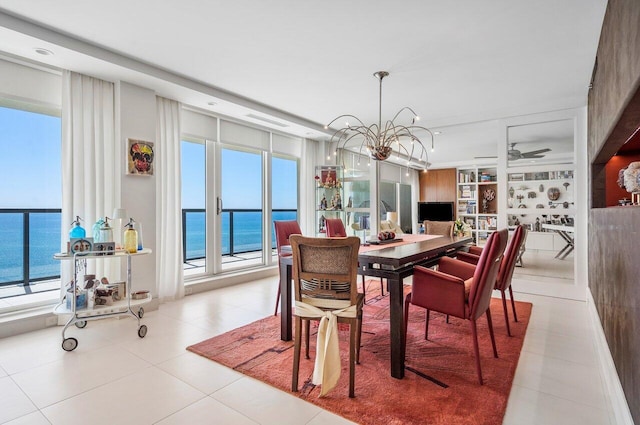 tiled dining room featuring built in shelves and ceiling fan with notable chandelier