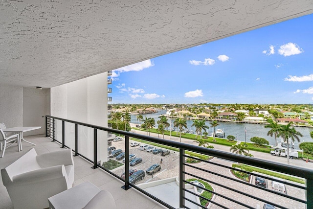 balcony featuring a water view