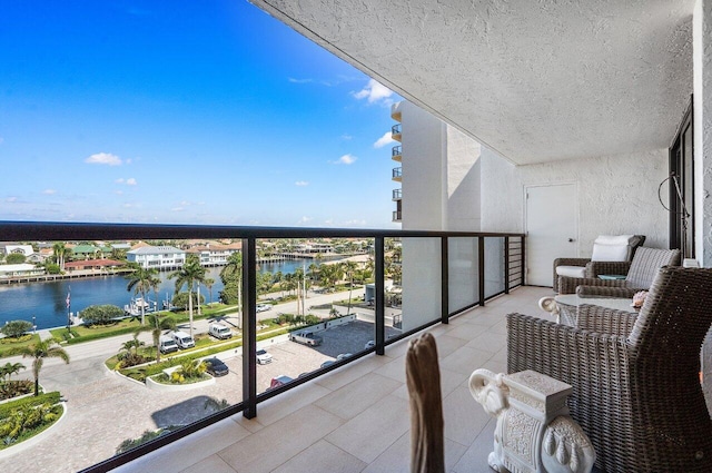 balcony featuring a water view