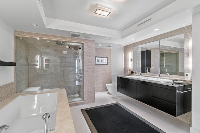 bathroom featuring tile patterned flooring, an enclosed shower, vanity, and toilet