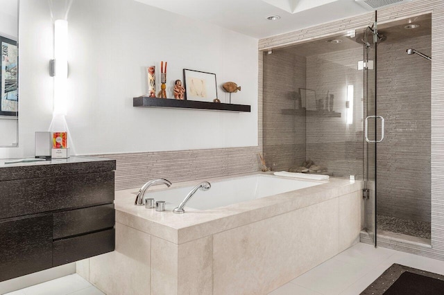 bathroom featuring tile patterned floors and plus walk in shower