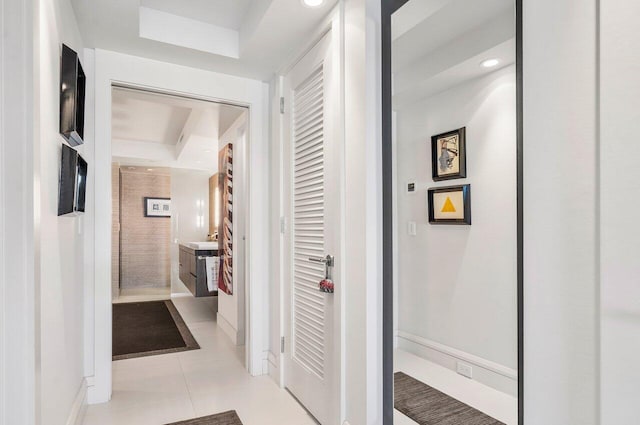 corridor with light tile patterned floors