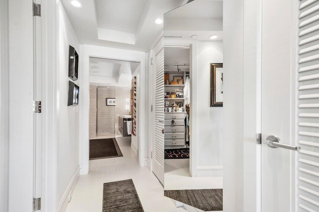 hallway featuring light tile patterned flooring