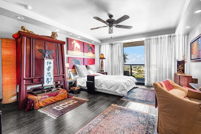 bedroom featuring dark hardwood / wood-style floors and ceiling fan