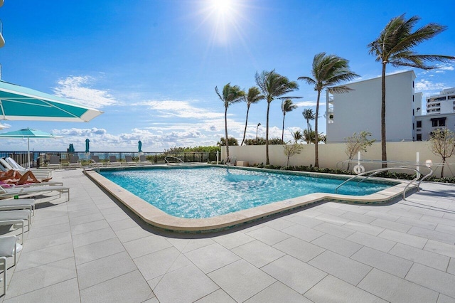 view of swimming pool featuring a patio