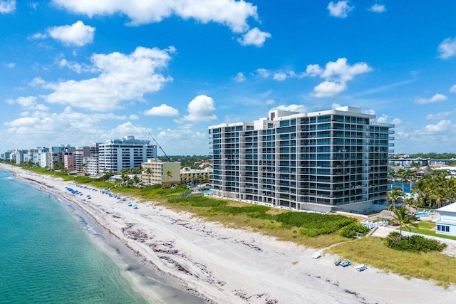 aerial view featuring a water view and a beach view