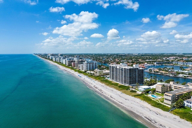 bird's eye view featuring a water view and a view of the beach