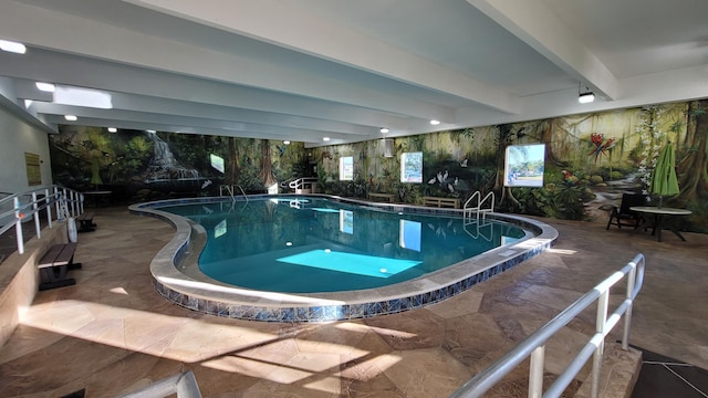 view of swimming pool with a patio area