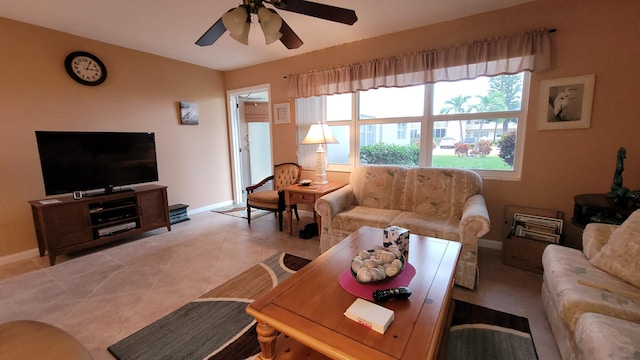 tiled living room featuring ceiling fan