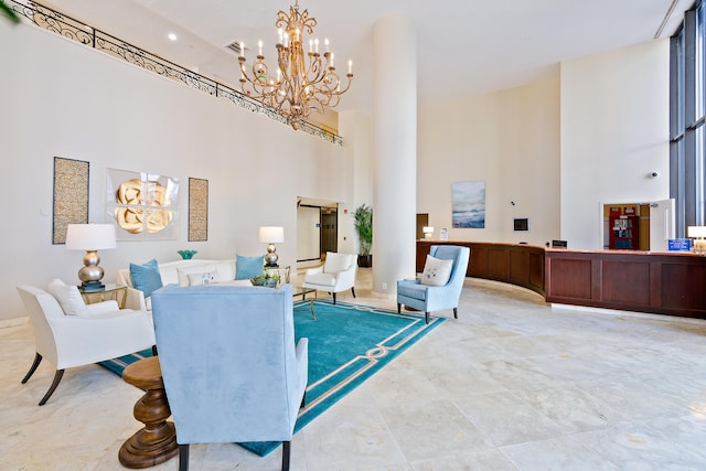 interior space featuring a chandelier and a high ceiling