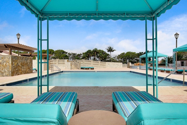 view of pool featuring a gazebo and a patio area