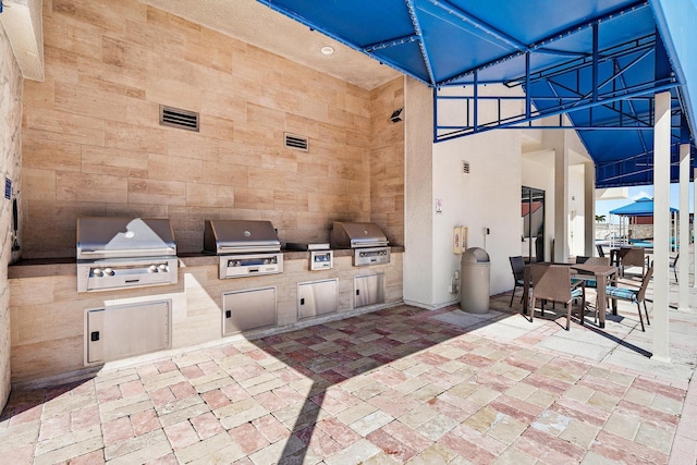 view of patio / terrace featuring exterior kitchen and grilling area