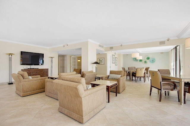 living room with ornamental molding and light tile patterned floors