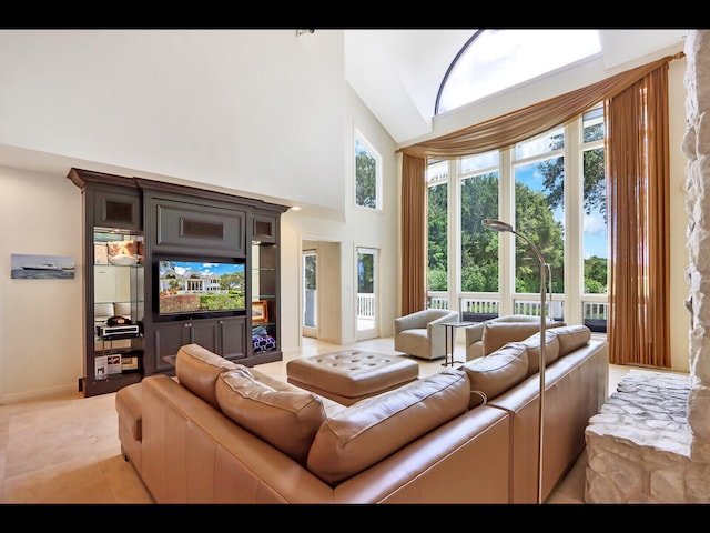 living room featuring a towering ceiling