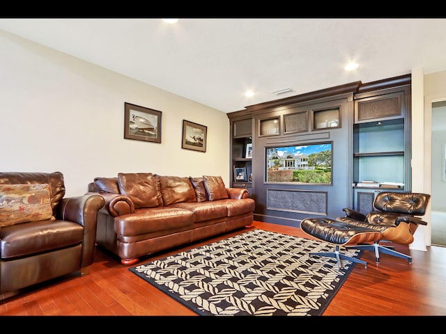 living room with dark hardwood / wood-style flooring