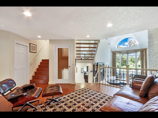 living room with a textured ceiling