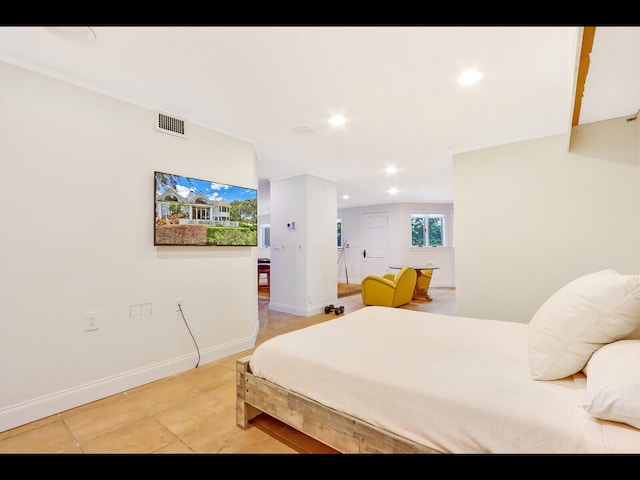 bedroom with light tile patterned floors