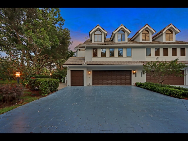 view of front of property with a garage