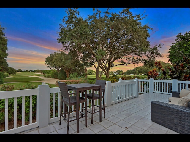 view of patio terrace at dusk