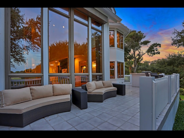 patio terrace at dusk with an outdoor hangout area