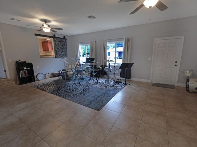 dining space featuring light tile patterned floors, a ceiling fan, and visible vents