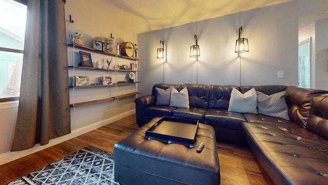 living room with baseboards and wood finished floors