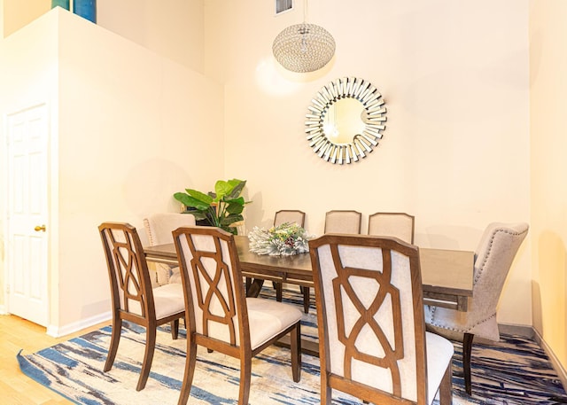 dining space featuring hardwood / wood-style flooring