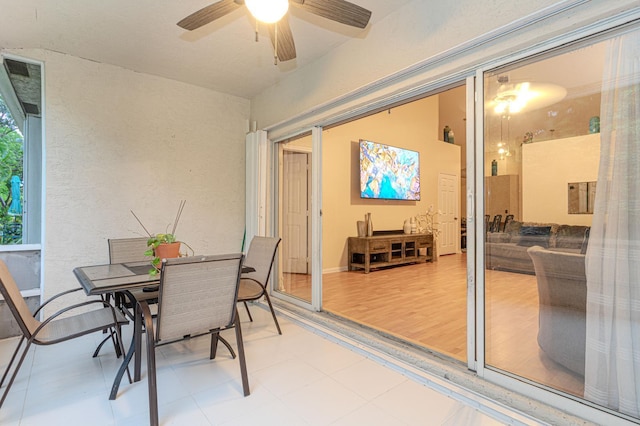 interior space with hardwood / wood-style floors and ceiling fan