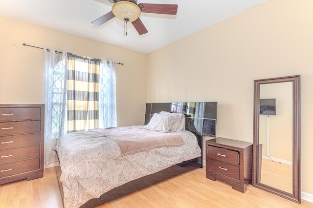 bedroom featuring ceiling fan and light hardwood / wood-style flooring