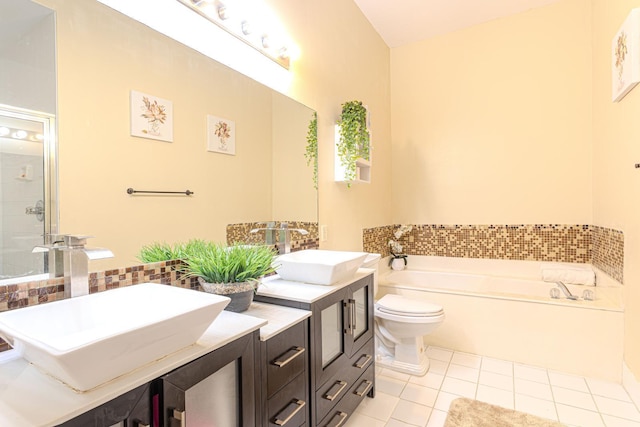 full bathroom featuring shower with separate bathtub, vanity, tile patterned flooring, and toilet