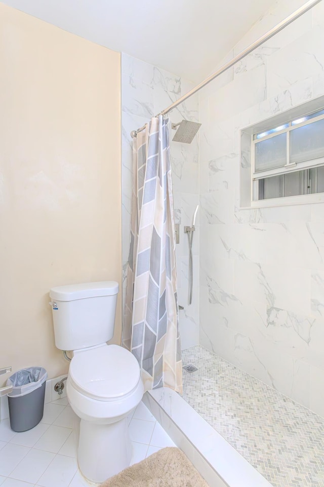 bathroom with toilet, tile patterned floors, and a shower with curtain