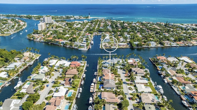 birds eye view of property featuring a water view and a residential view