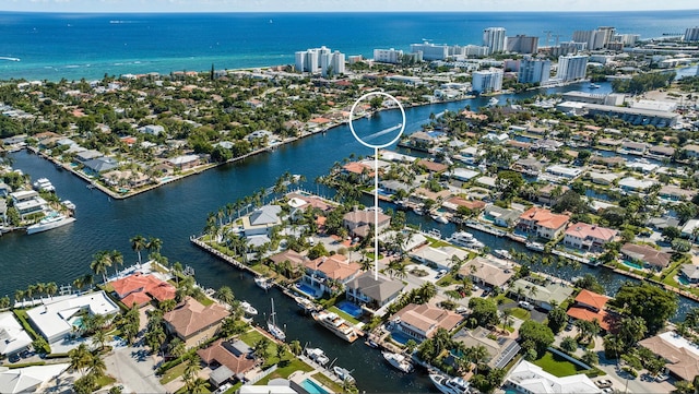 birds eye view of property featuring a water view and a residential view