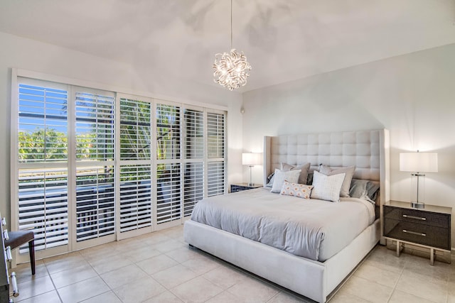 tiled bedroom with a chandelier