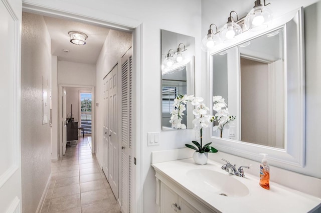 2156 Wightman Dr, Wellington, FL 33414 - bathroom with tile patterned floors, vanity, and baseboards