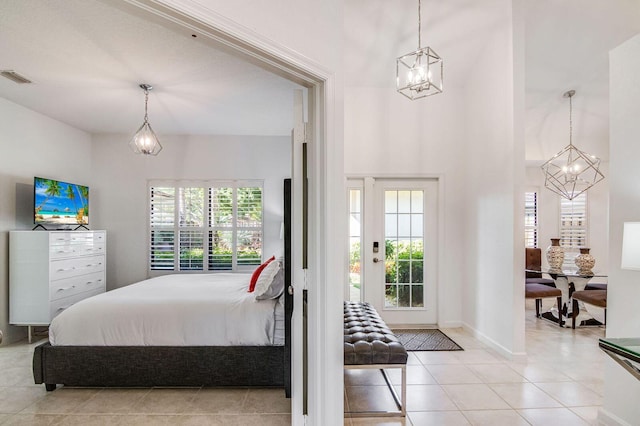 2156 Wightman Dr, Wellington, FL 33414 - bedroom featuring light tile patterned flooring, an inviting chandelier, multiple windows, and visible vents
