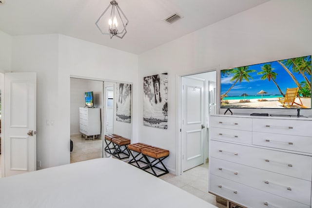 bedroom featuring light tile patterned floors and a closet