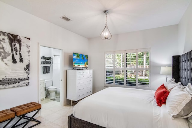 2156 Wightman Dr, Wellington, FL 33414 - bedroom featuring light tile patterned flooring, ensuite bathroom, and visible vents