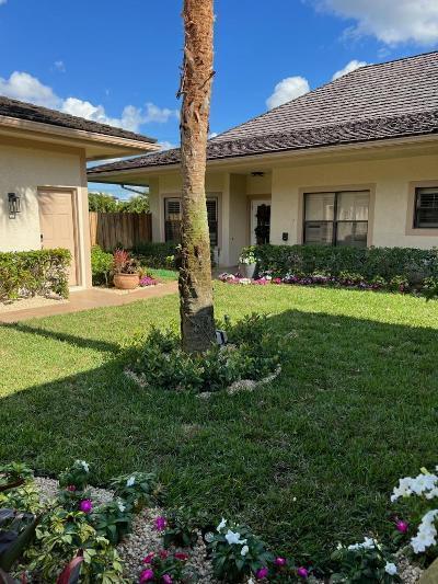 2156 Wightman Dr, Wellington, FL 33414 - exterior space with a yard, stucco siding, and fence